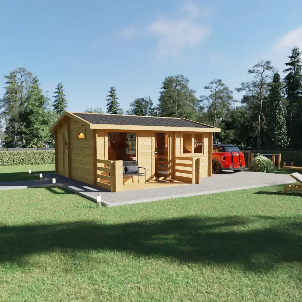 Small wooden cabin with a bench on the front porch, a paved walkway, surrounded by grass and trees, under a clear blue sky.