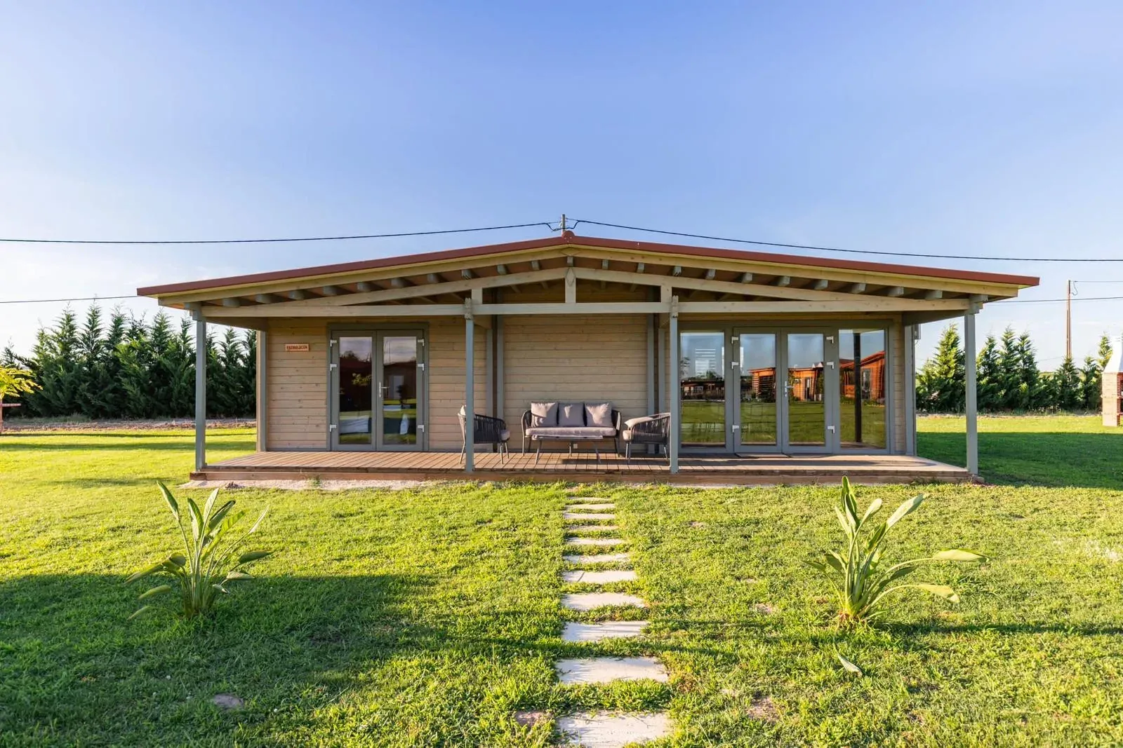 Finished Satus Baltic garden house on a lawn