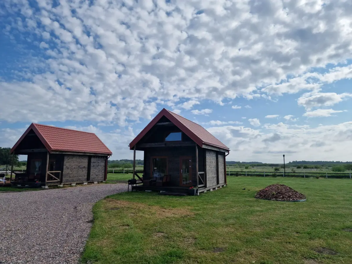 Several Satus Baltic log cabins with terraces on one site